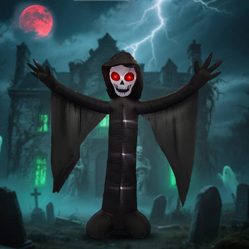 Tall inflatable black ghost with a skull face and outstretched ragged sleeves in a stormy graveyard