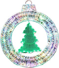 Round pre-lit wreath with a small green tree hanging in the center