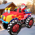 Inflatable red monster truck with flame decals and Santa in sunglasses in a snowy yard