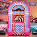 Inflatable retro jukebox in pink and blue at a fifties-themed party with classic cars