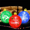 Three large inflatable Christmas balls in green, red and blue with reindeer, snowflake and Merry Christmas prints