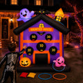 Inflatable purple haunted house toss game with numbered score holes, ghost on the roof and rings on the ground