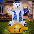 Inflatable white bear in a blue scarf holding a Star of David beside a menorah on a front lawn