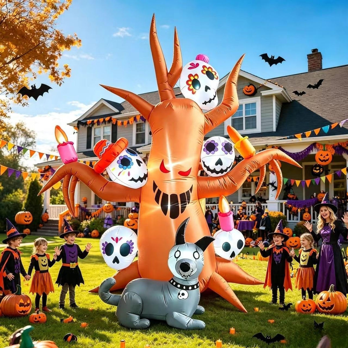 Inflatable haunted orange tree with skull faces and a grey skeleton dog in a Halloween yard