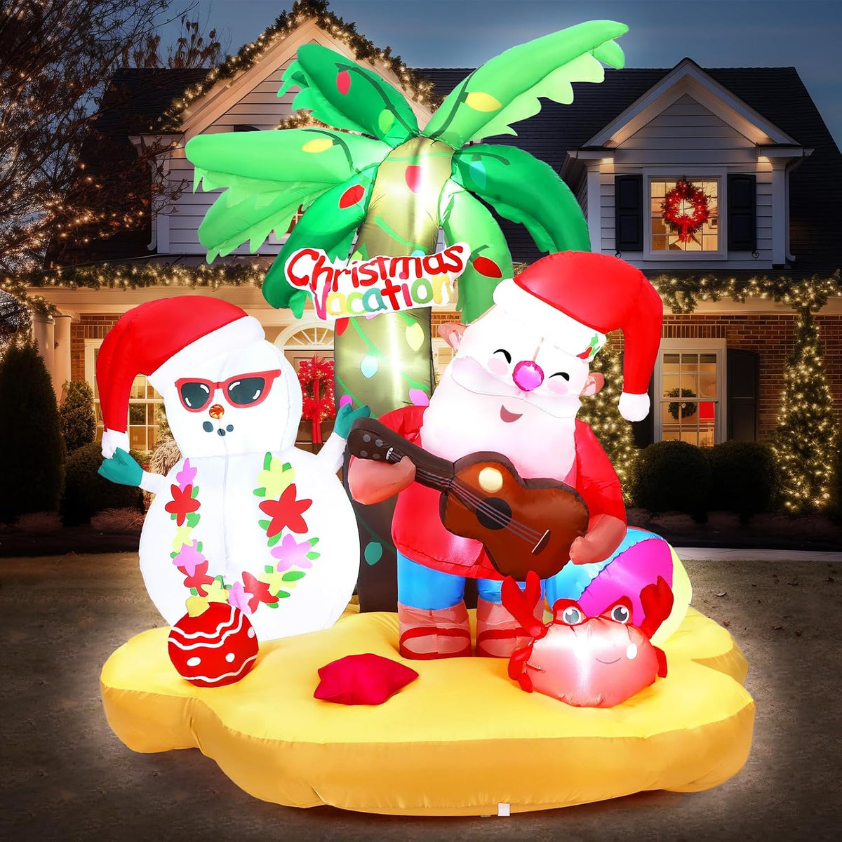 Inflatable tropical Christmas scene with Santa in sunglasses and a snowman under a palm tree on a sand base